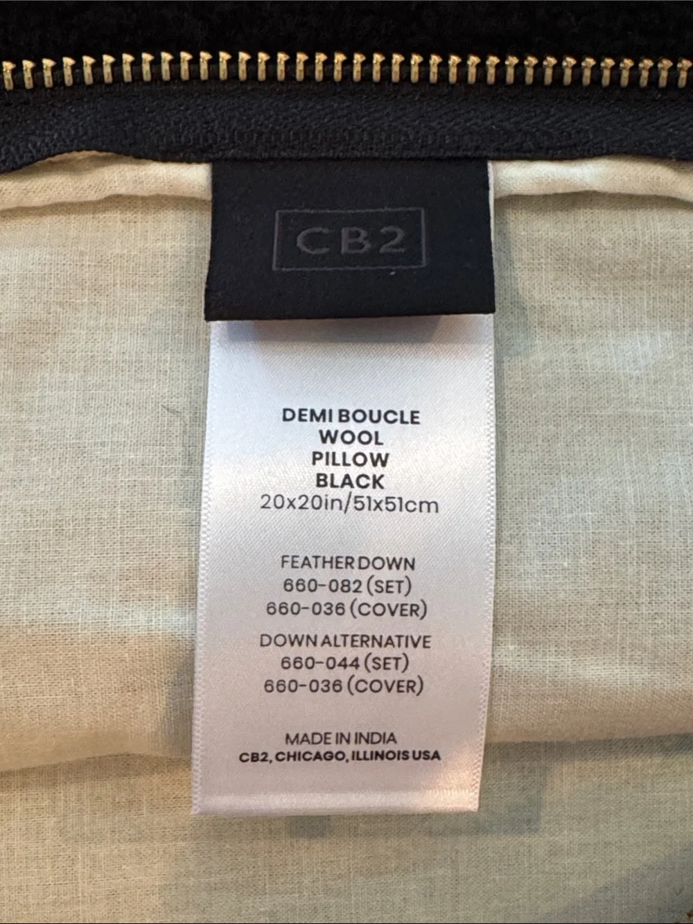 Two CB2 20x20in black boucle pillow covers